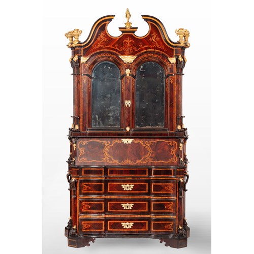 An Italian parcel-gilt, rosewood, marquetry and ebonized bureau cabinet. Rome, second quarter of the 18th Century.